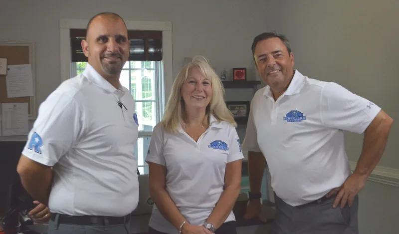 Mike Kabban, Courtney Markowski and Ronan Keane at the Ridgeline Roofers office